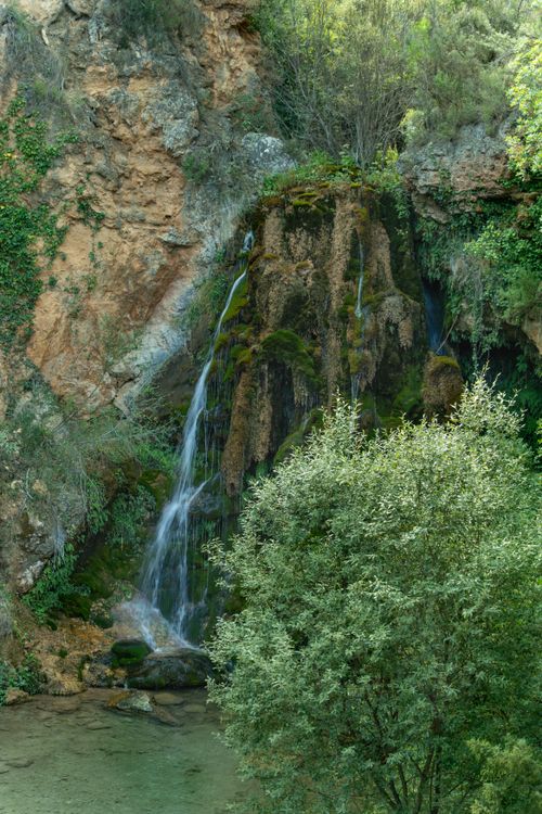 Free Mesmerizing waterfall cascading down rocky cliffs in Bogarra, Spain. Stock Photo