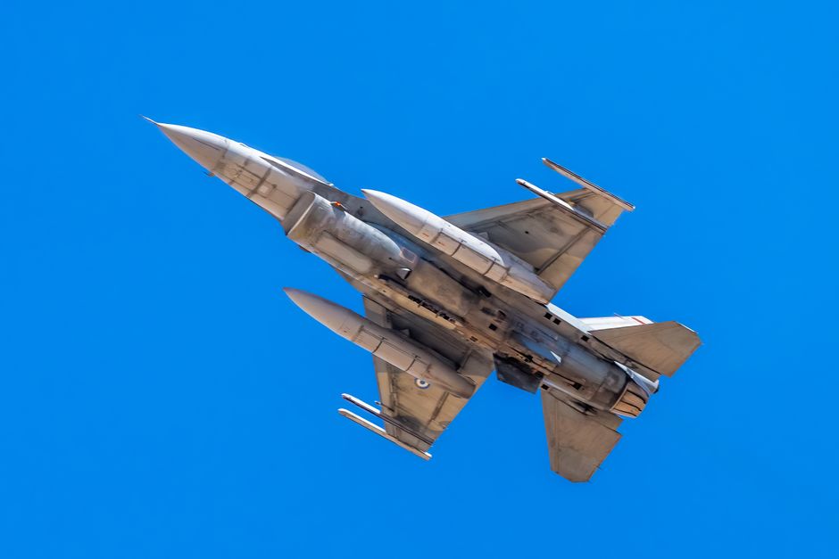 An F-16 Fighting Falcon on the tarmac, illustrating the lower fighter jet operating costs compared to stealth alternatives.