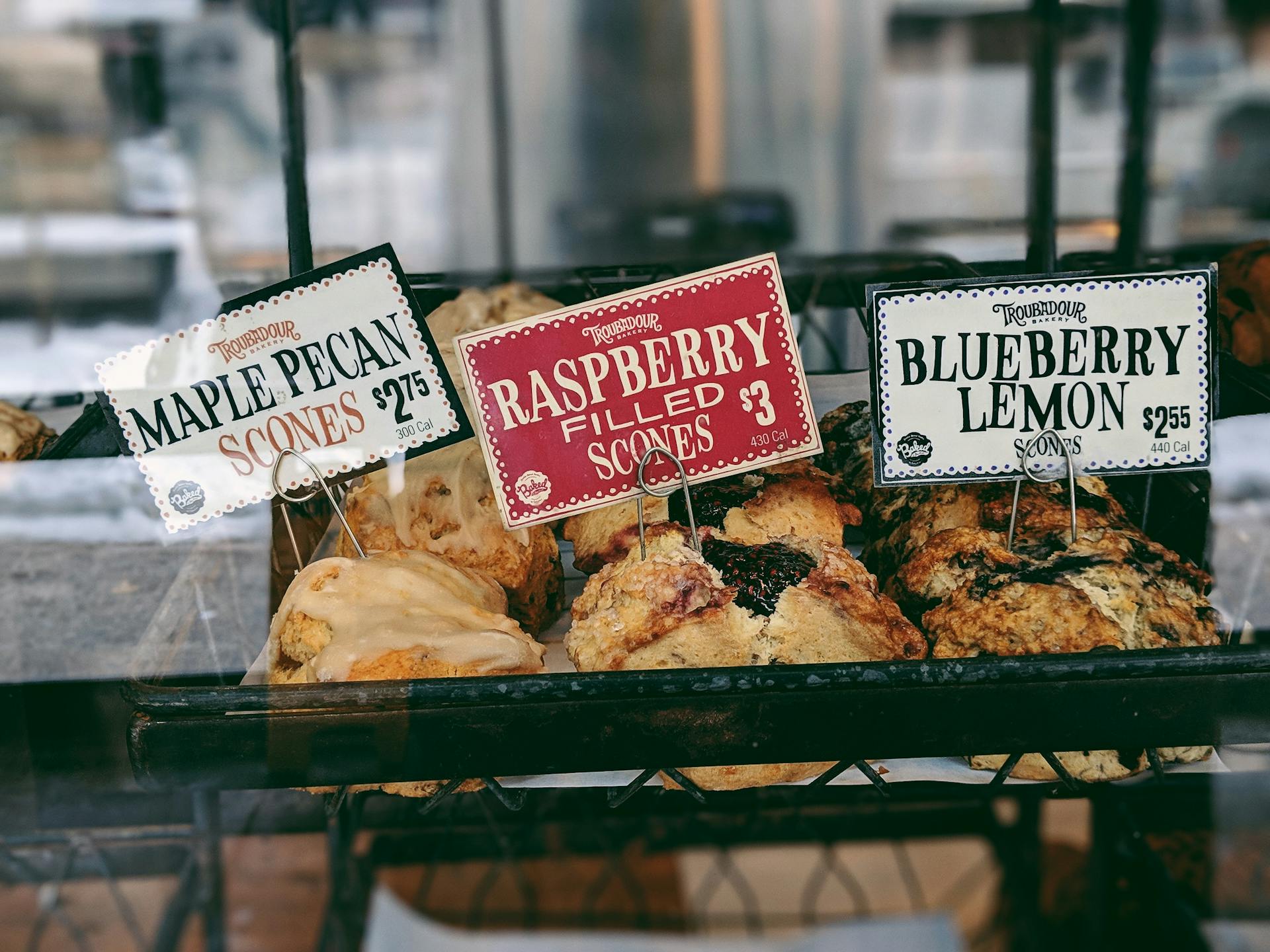 Raspberry Filled Scones at 3 Dollar, Blueberry Lemon Scones at 2.65 Dollar, and Maple Pecan Scones at 2.75 Dollar