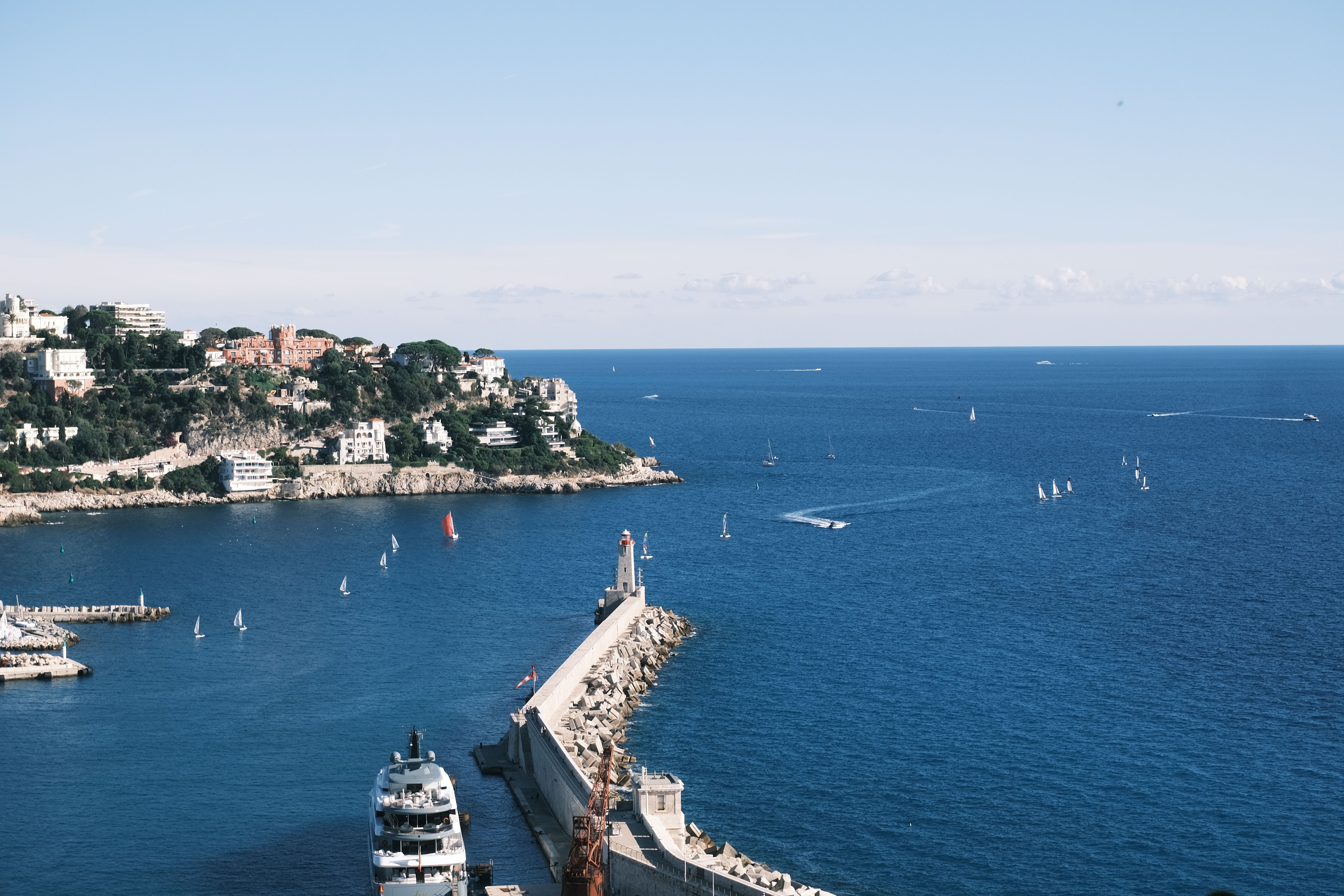 Beautiful seaside view in Nice, France, with yachts and sailboats on a sunny day.