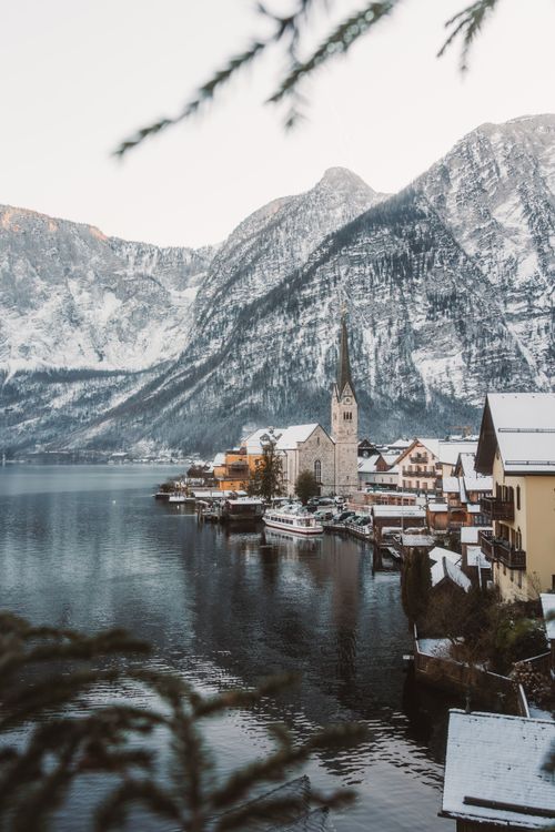 Free A serene winter view of Hallstatt village with the Alps and lake in Upper Austria. Stock Photo