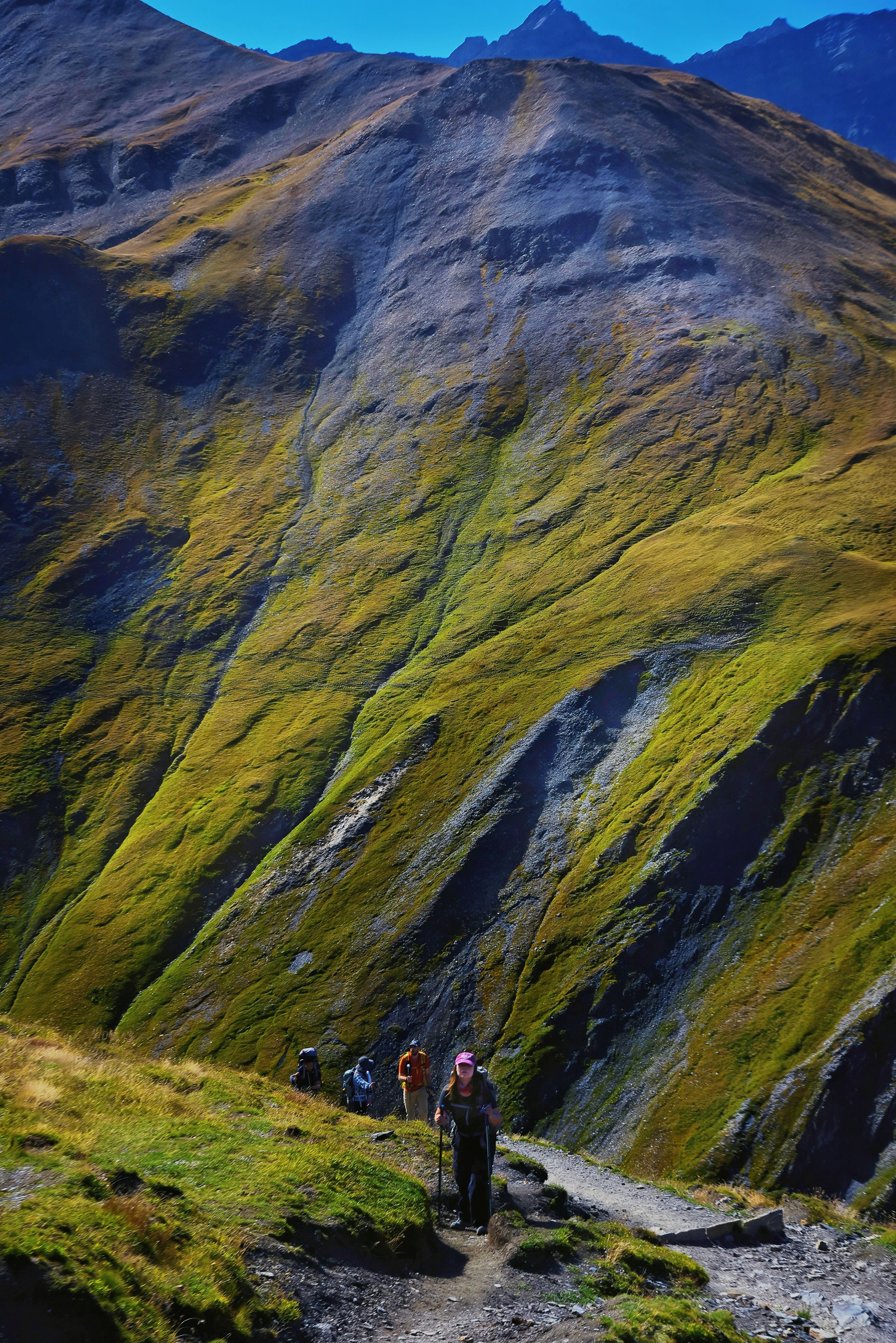 Group climbing a colourful autumn trail — photo by KIM GUAN CHU on Pexels