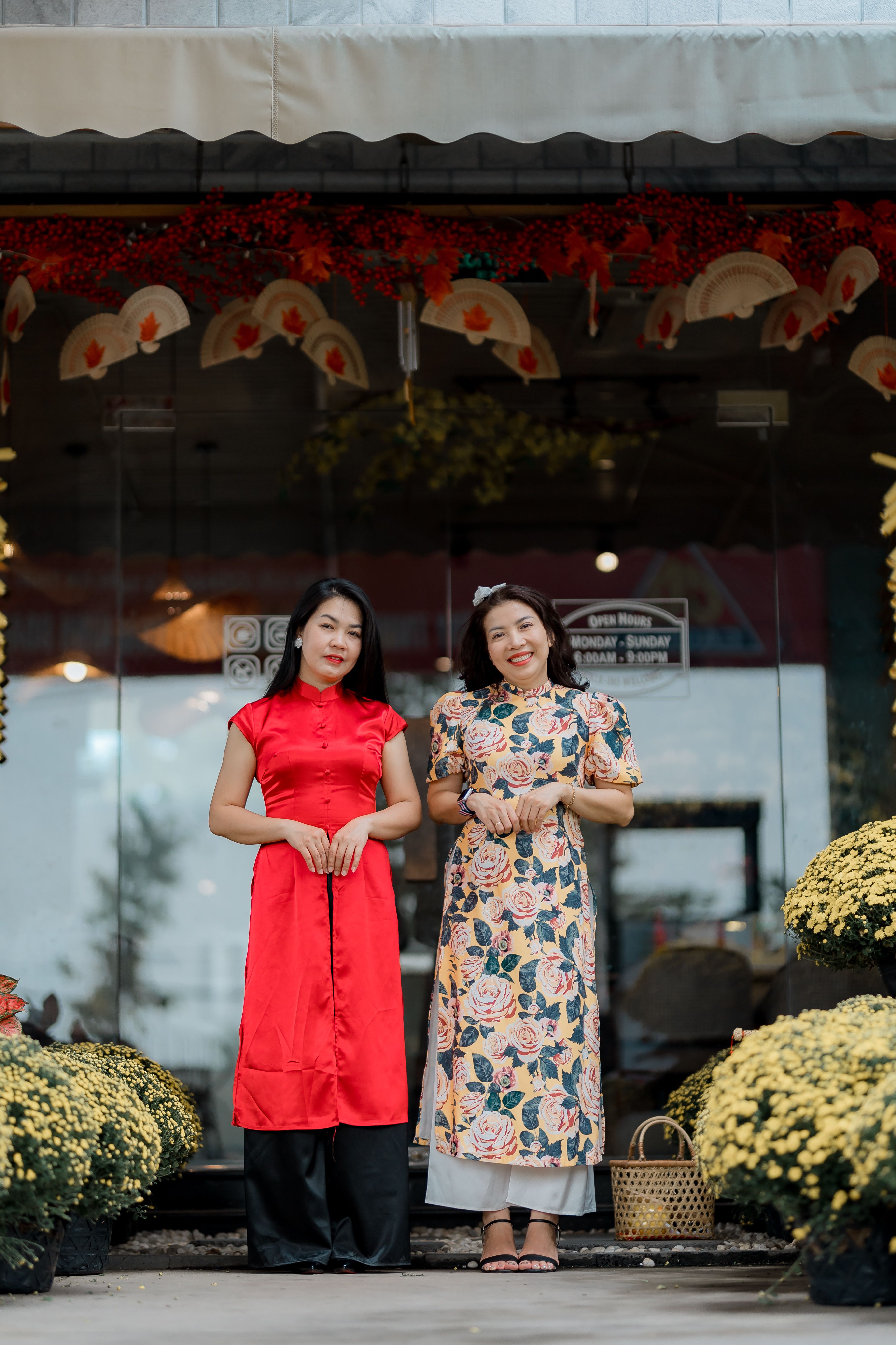 Two Women in Traditional Dresses at Storefront · Free Stock Photo