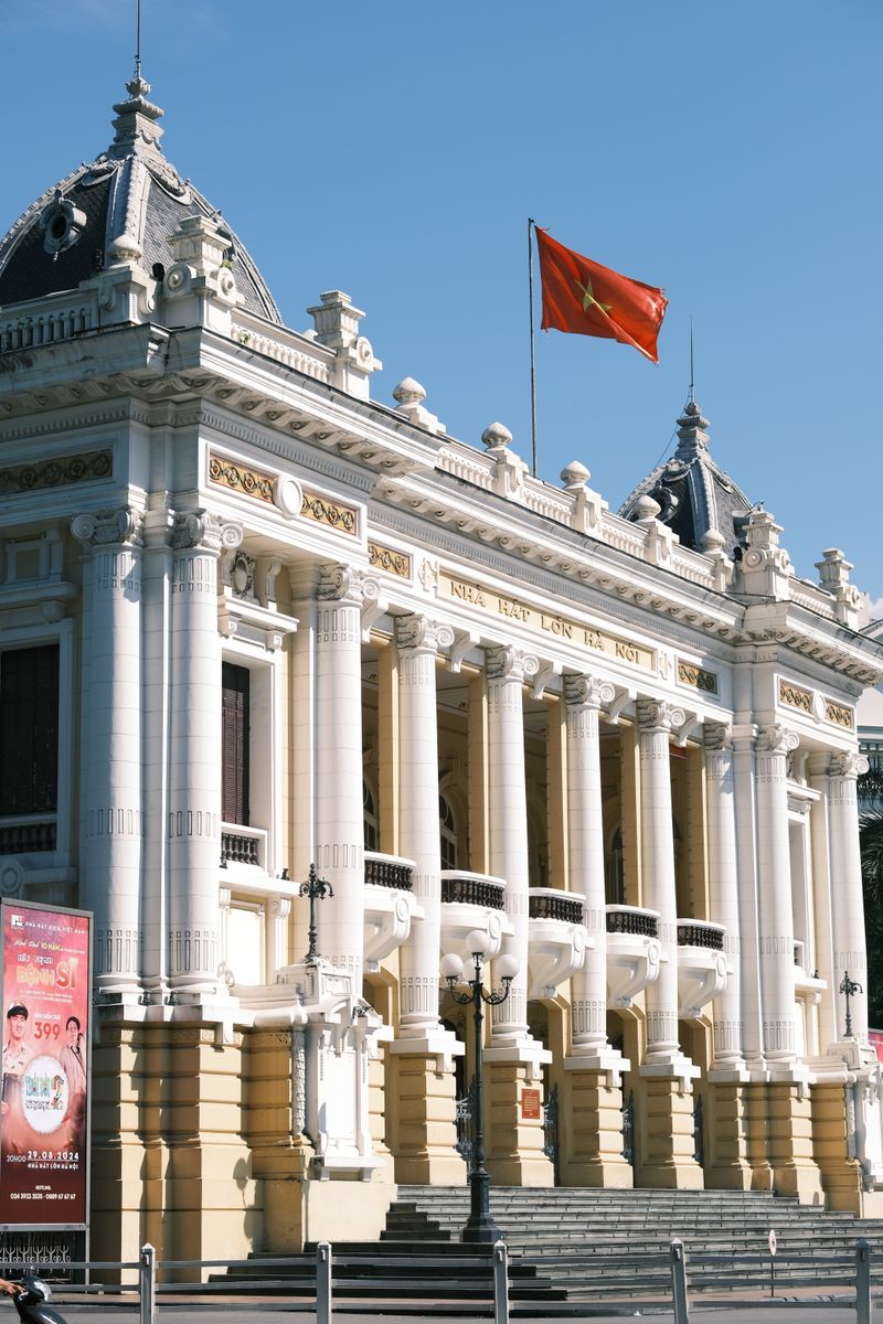 Hanoi Opera House facade with Vietnamese flag