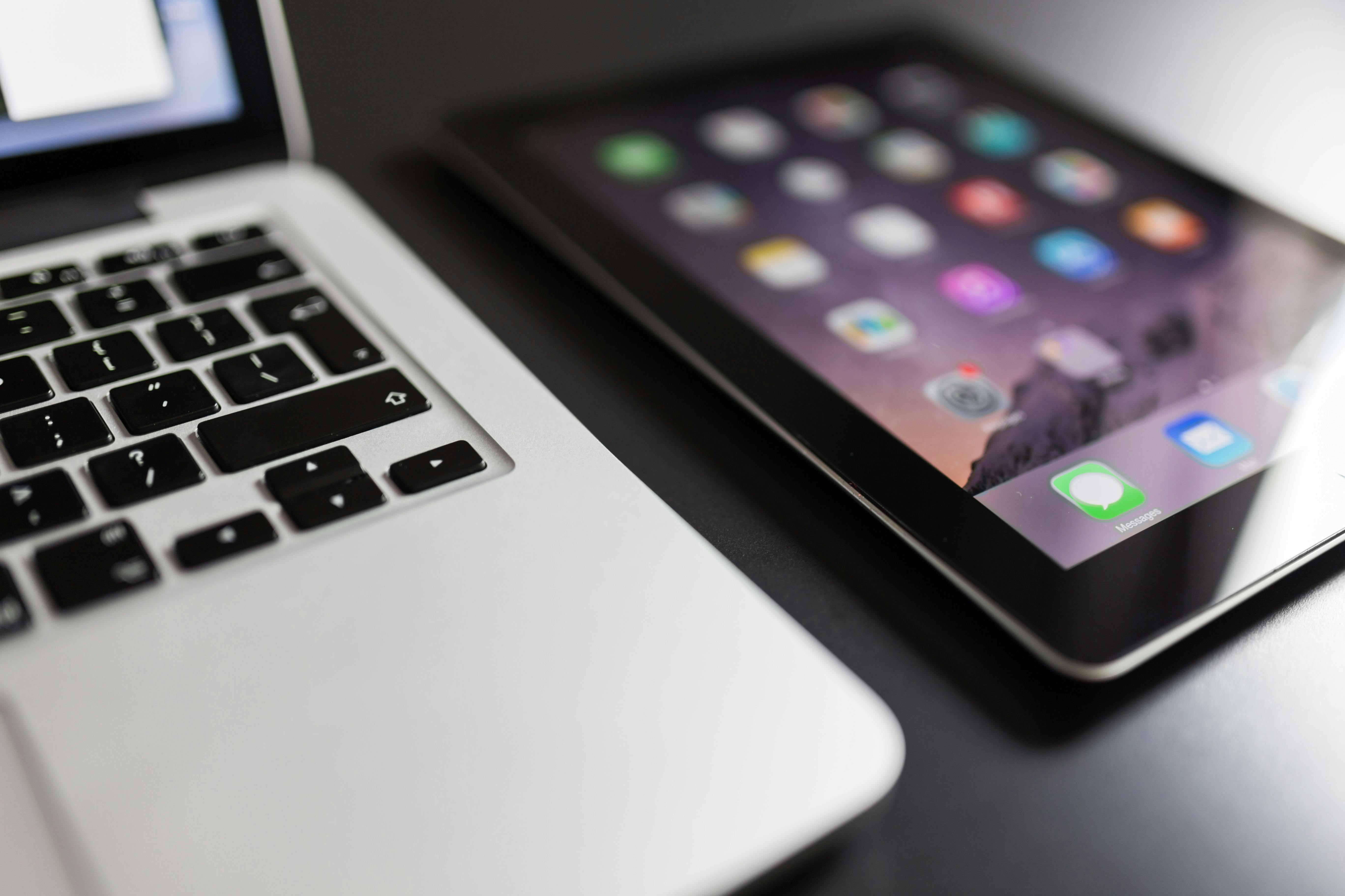 Black Ipad Beside Macbook Air \u00b7 Free Stock Photo