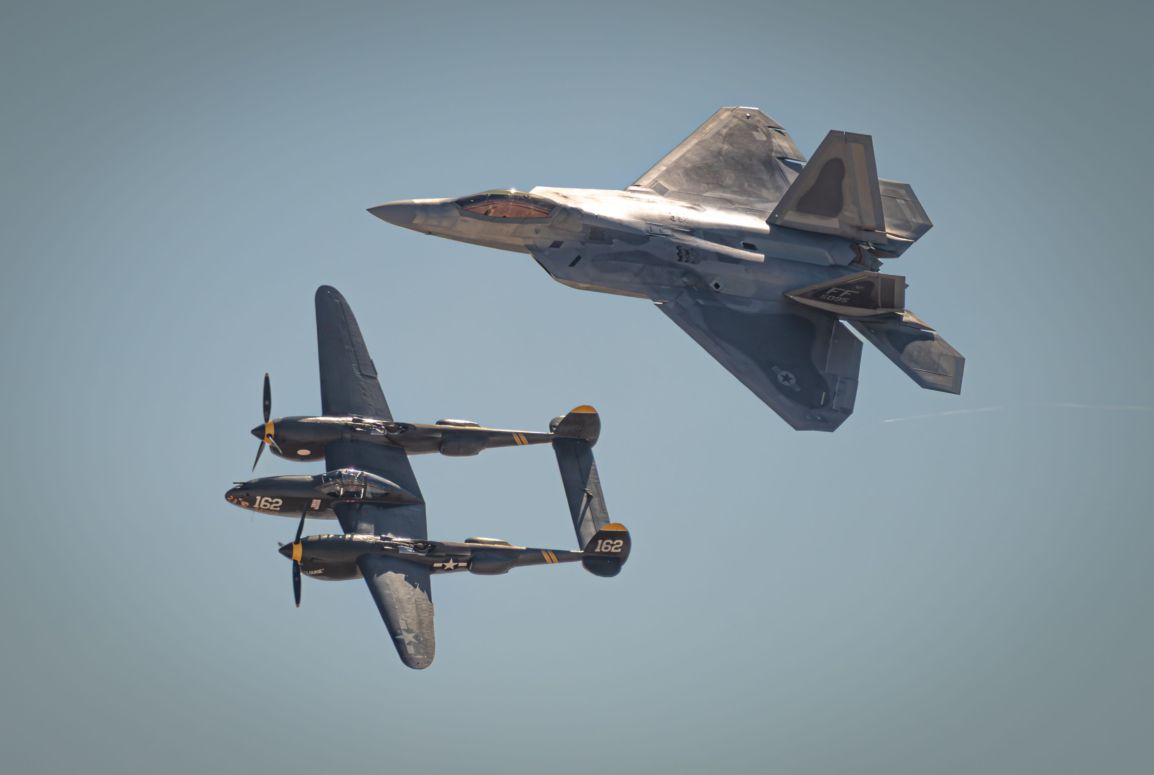 F-22 Raptor and P-38 Lightning in Heritage Flight · Free Stock Photo