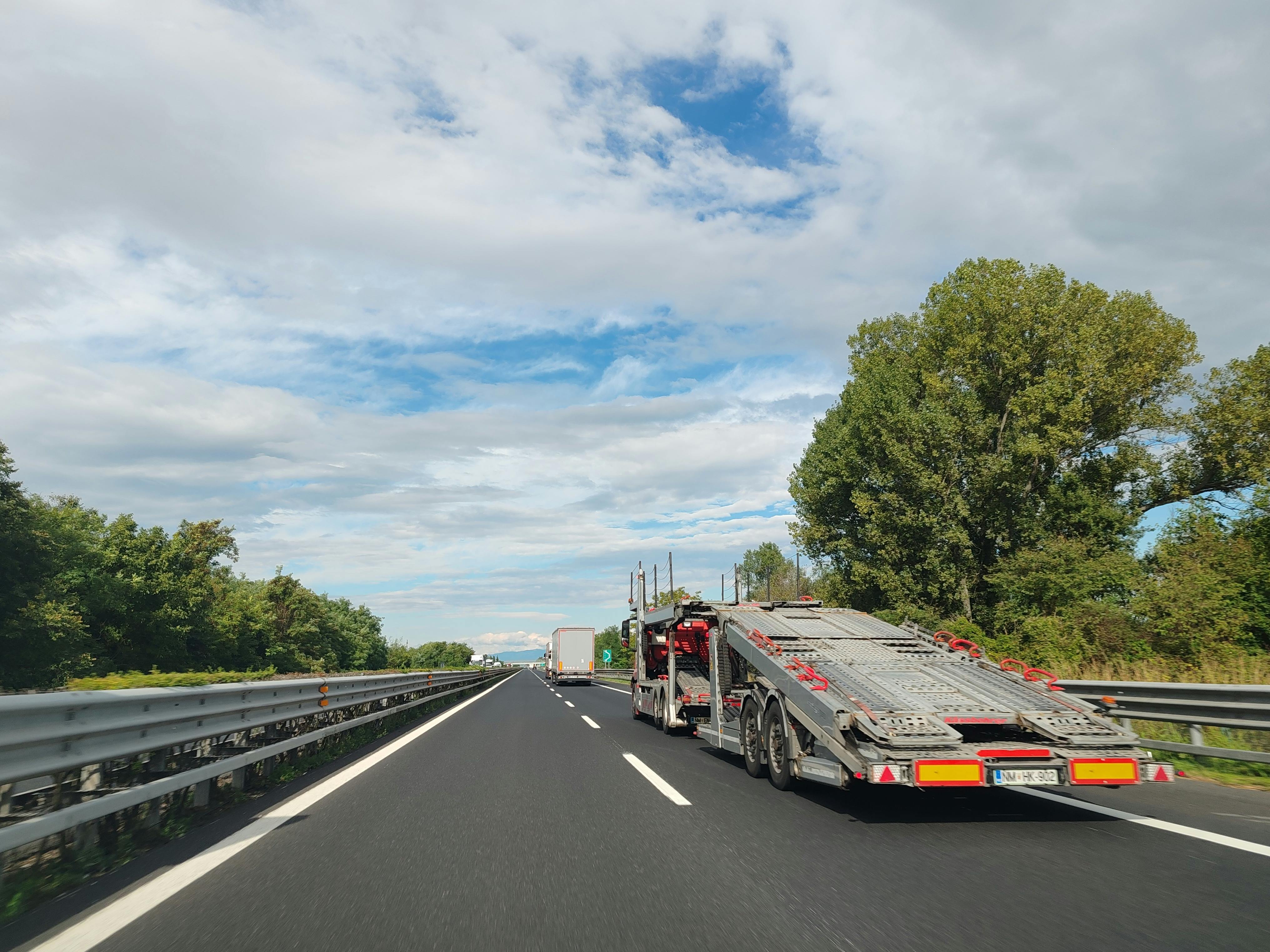 semi-truck next to a standard passenger car, illustrating the size difference - truck accident attorney Santa Ana