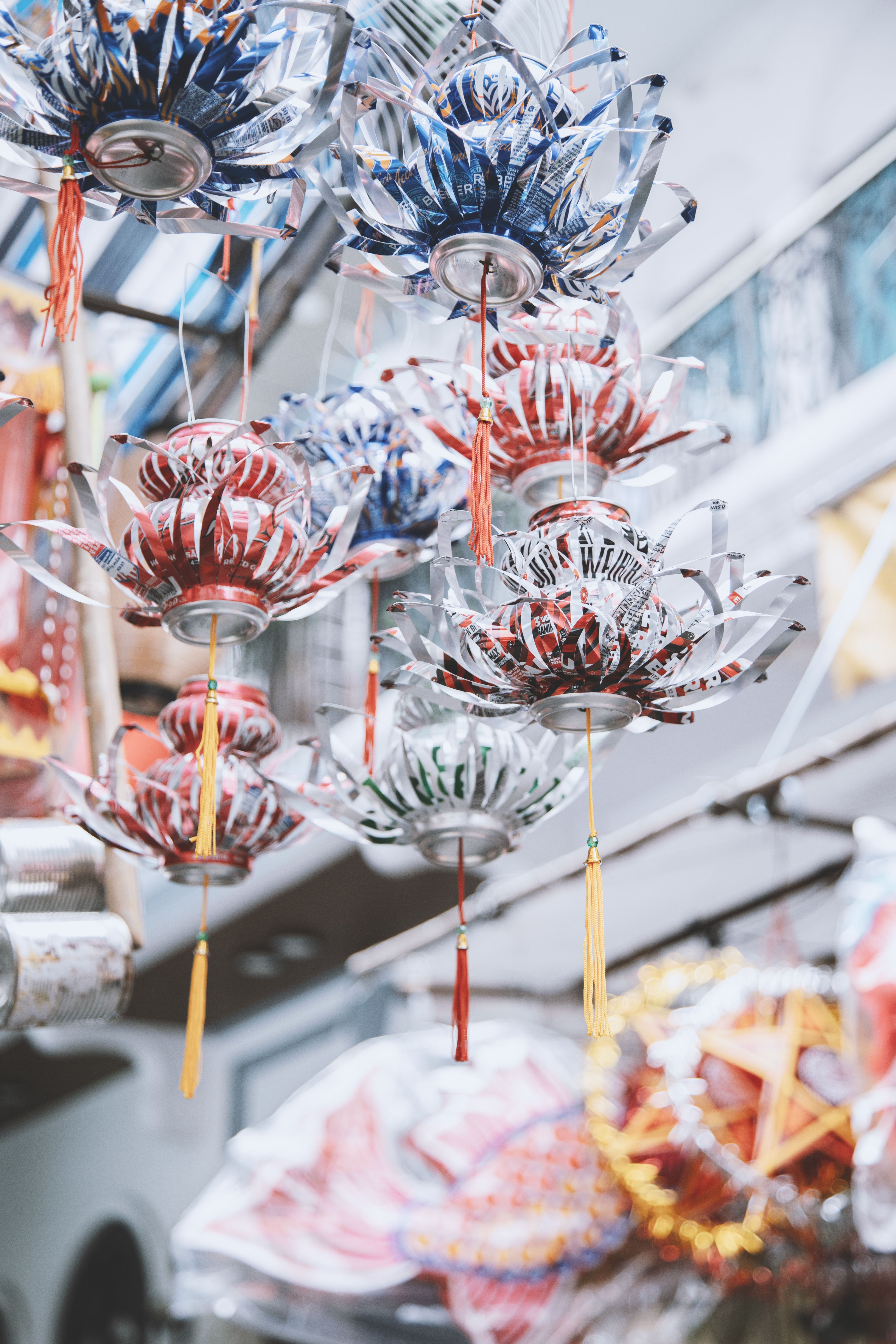 Vibrant recycled lanterns hanging in Ho Chi Minh City during mid-autumn festival.