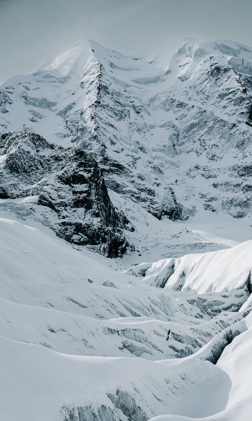 Free Breathtaking view of snow-covered peaks in the Swiss Alps, capturing winter's beauty. Stock Photo
