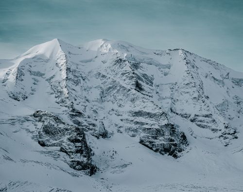 Free Stunning view of snow-covered mountains in Graubünden, Switzerland, captured in winter. Stock Photo