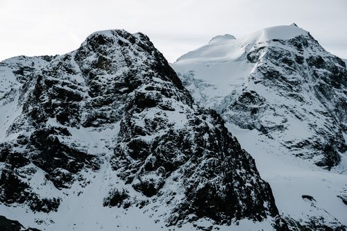 Free Breathtaking view of snow-covered mountains in Graubünden, Switzerland. Stock Photo