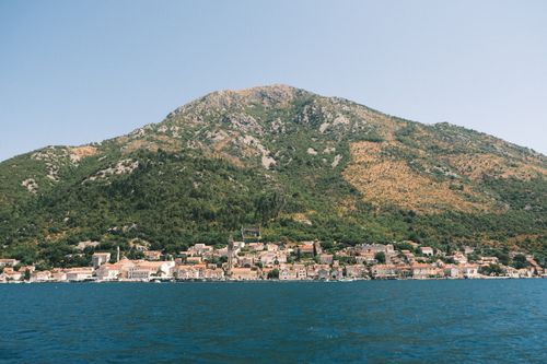 Free Charming view of Perast town with mountains in the background by the Adriatic Sea in Montenegro. Stock Photo