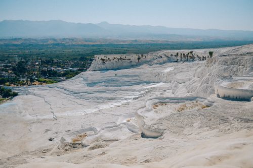Free A breathtaking view of Pamukkale's white terraces and the surrounding landscape, Turkey. Stock Photo