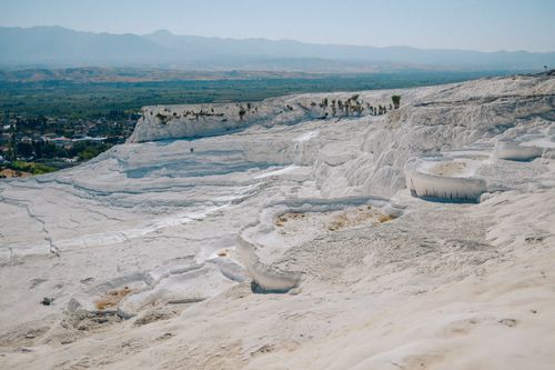 Free Breathtaking landscape of Pamukkale's white travertine terraces under a clear sky. Stock Photo