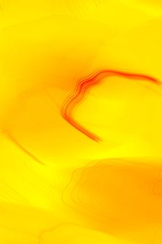 A vibrant abstract art piece featuring flowing yellow and red waves, creating a dynamic and energetic visual.