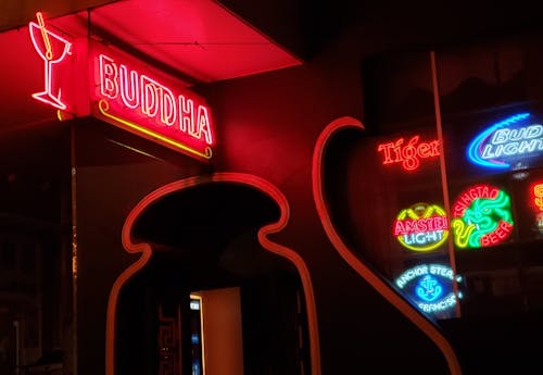 Red and White Buddha Neon Lights Sign during Night Time