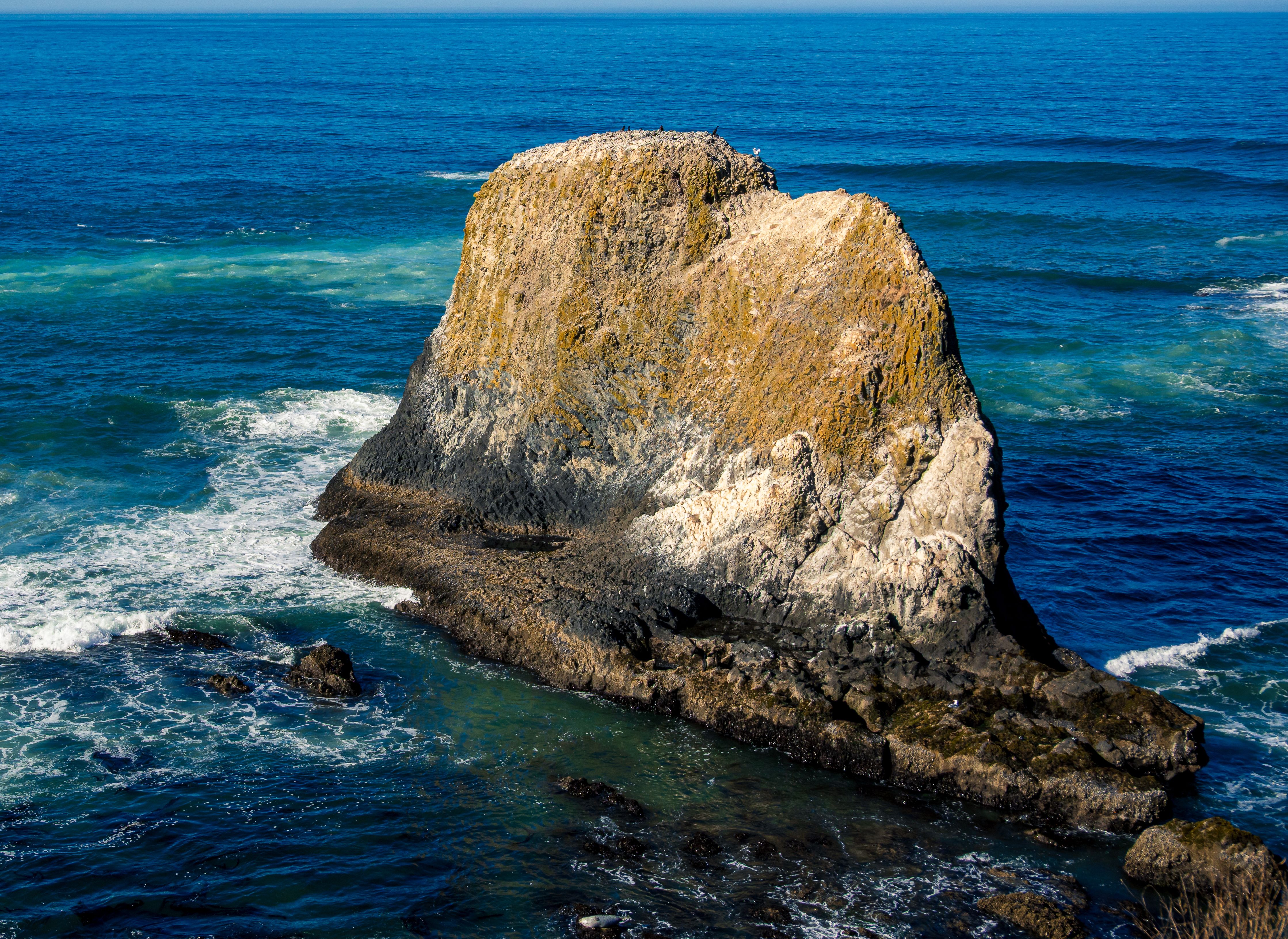 Majestic Coastal Rock Formation by the Sea · Free Stock Photo