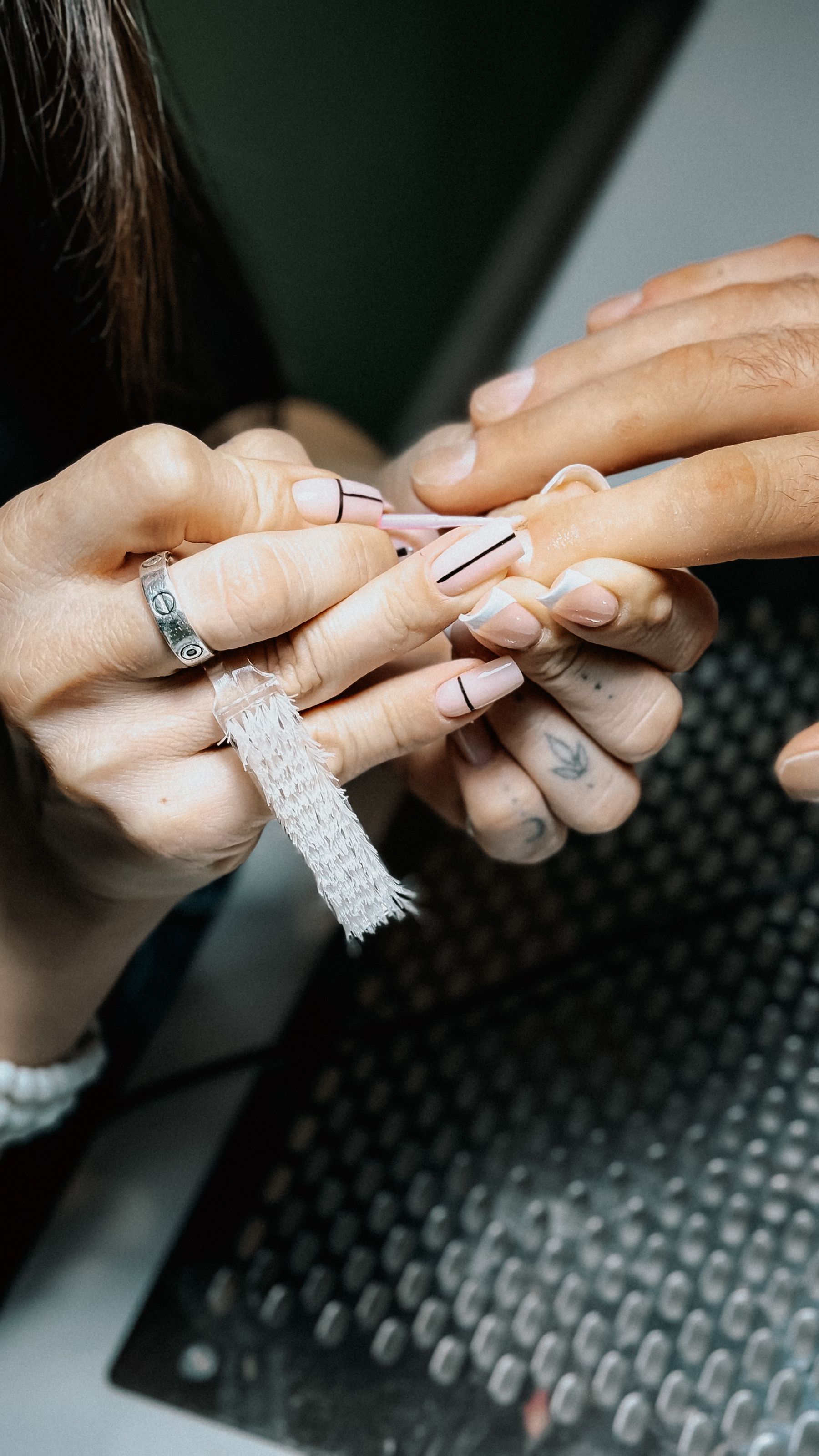 Close-up of detailed manicure and nail finishing work
