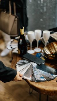 A stylish party table setup with champagne and decor samples, perfect for interior design inspiration.
