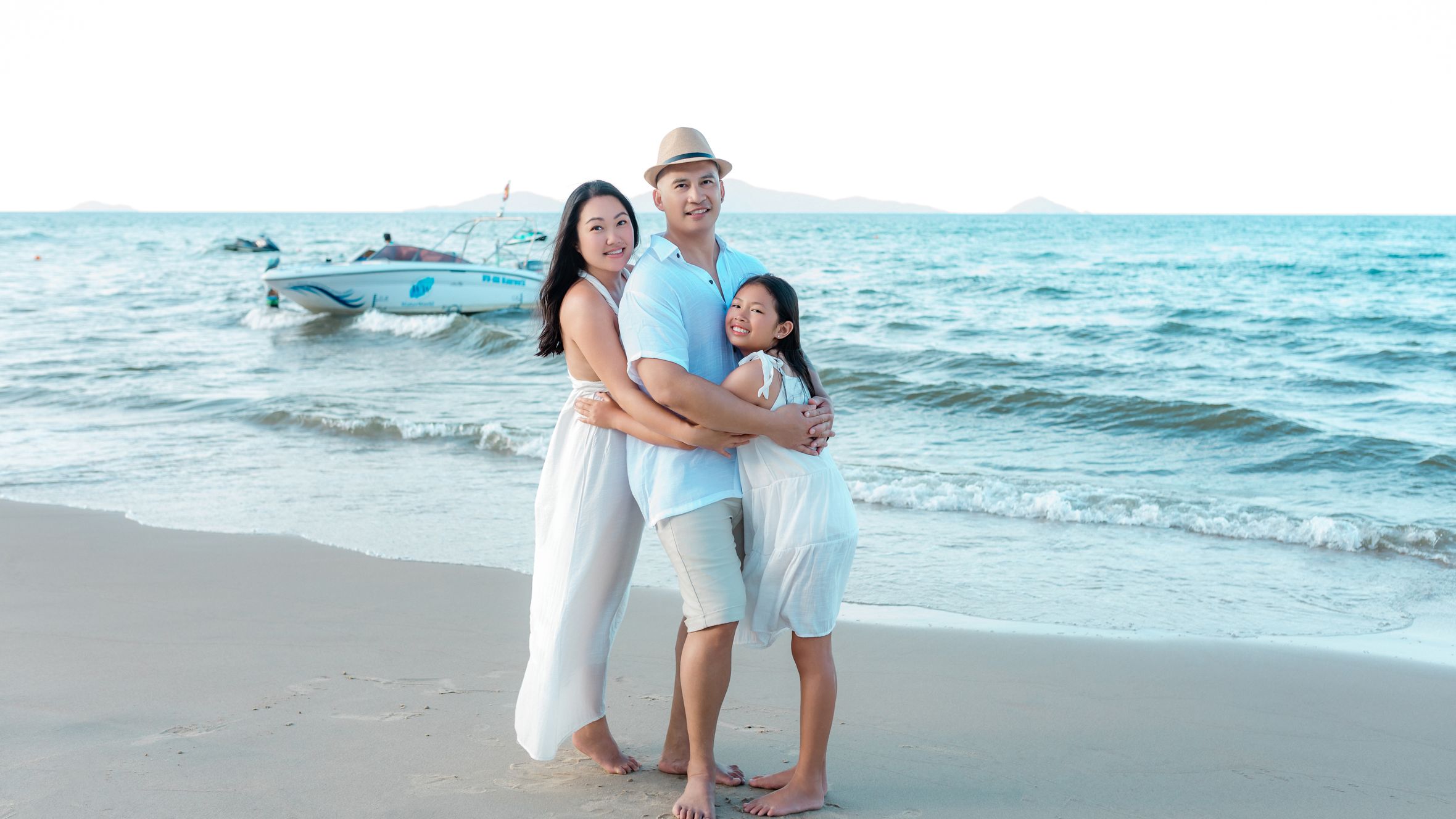 Happy family bonding on the beach in Hội An, enjoying the summer sun and sea.