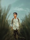 Young Man in a Field Wearing Sunglasses
