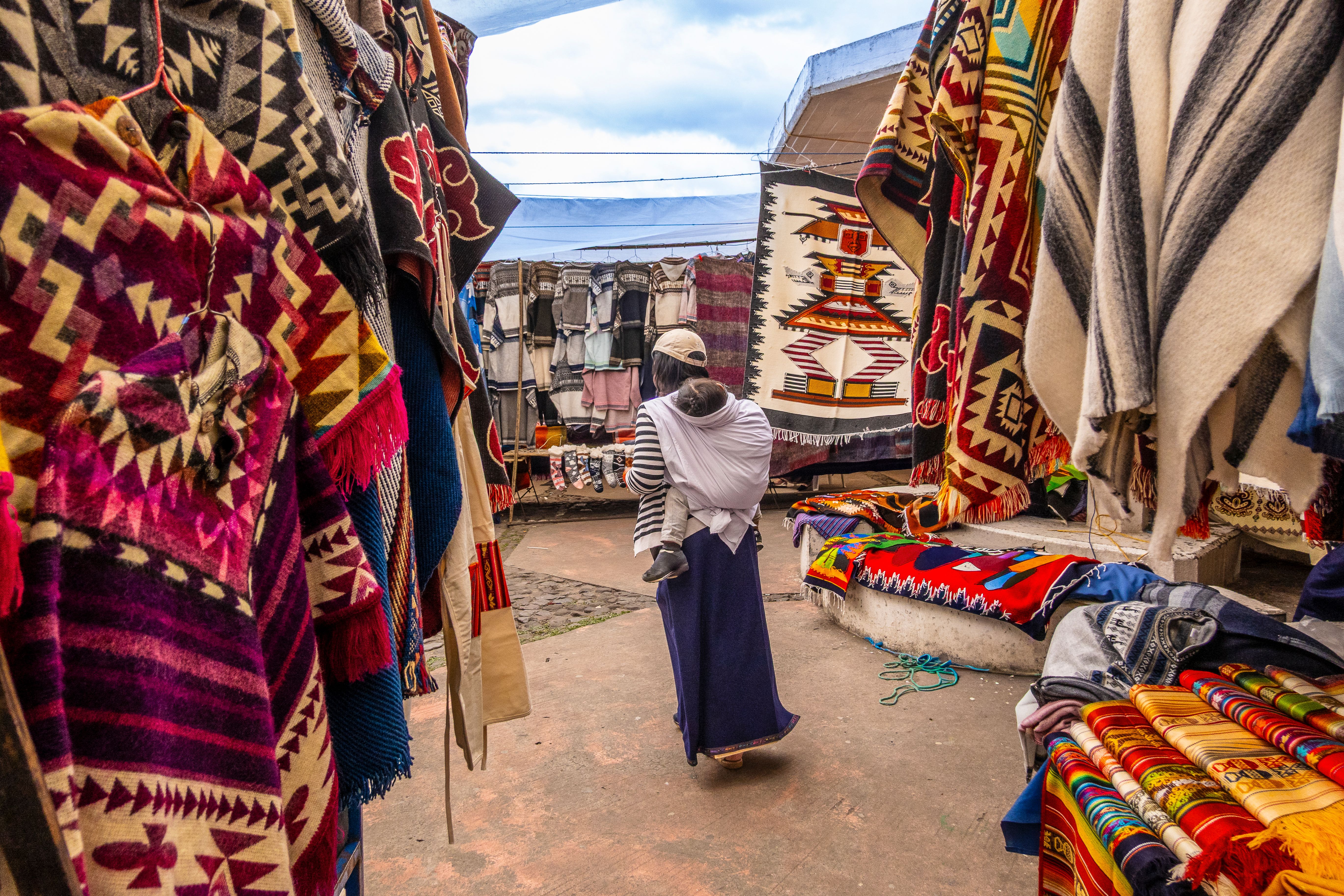 Colorful textile stalls at Otavalo Market, Ecuador