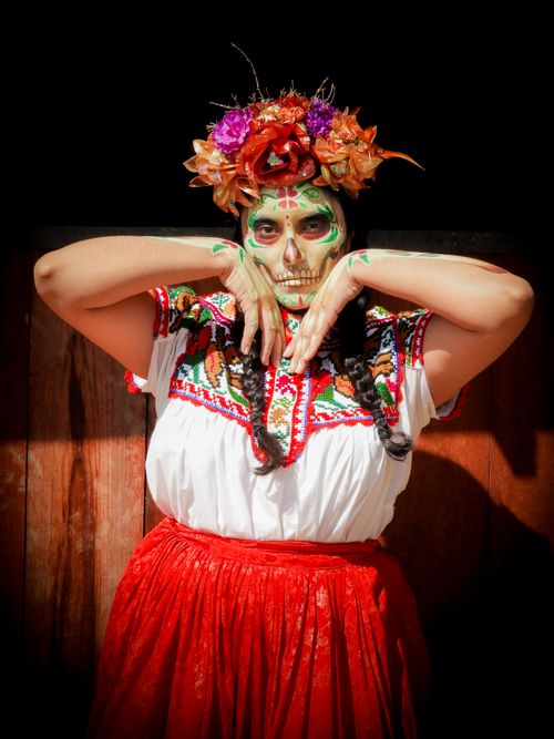 Free A woman adorned with vibrant Dia de Muertos makeup and traditional dress in Mexico City. Stock Photo