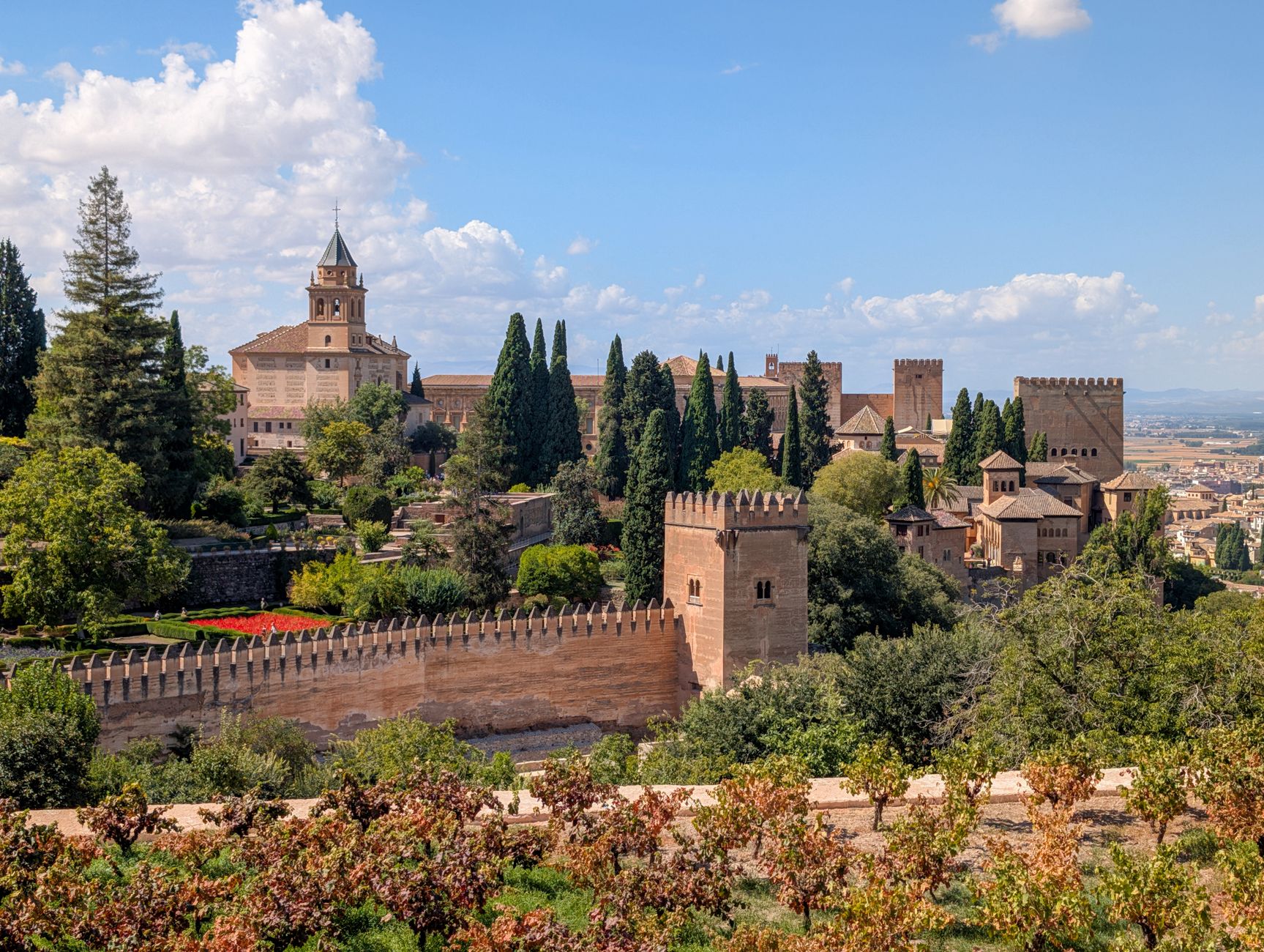 Explore the historic Alhambra fortress and lush gardens in Granada, a UNESCO World Heritage site.