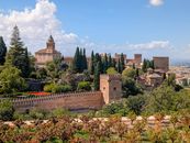 Explore the historic Alhambra fortress and lush gardens in Granada, a UNESCO World Heritage site.