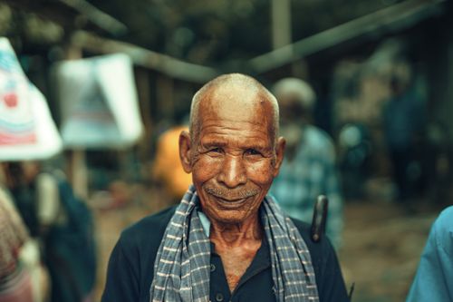 Free Smiling senior man outdoors in Bangladesh, showcasing culture and wisdom. Stock Photo