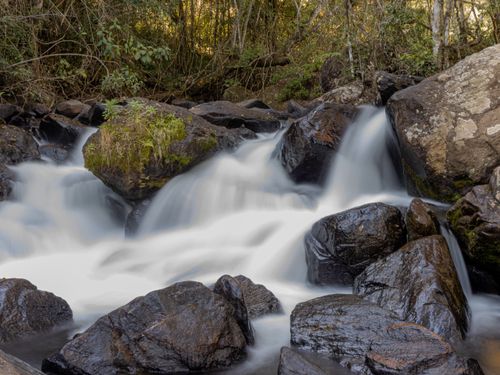 Free Beautiful waterfall in lush forest of Joanópolis, São Paulo, Brazil. Stock Photo