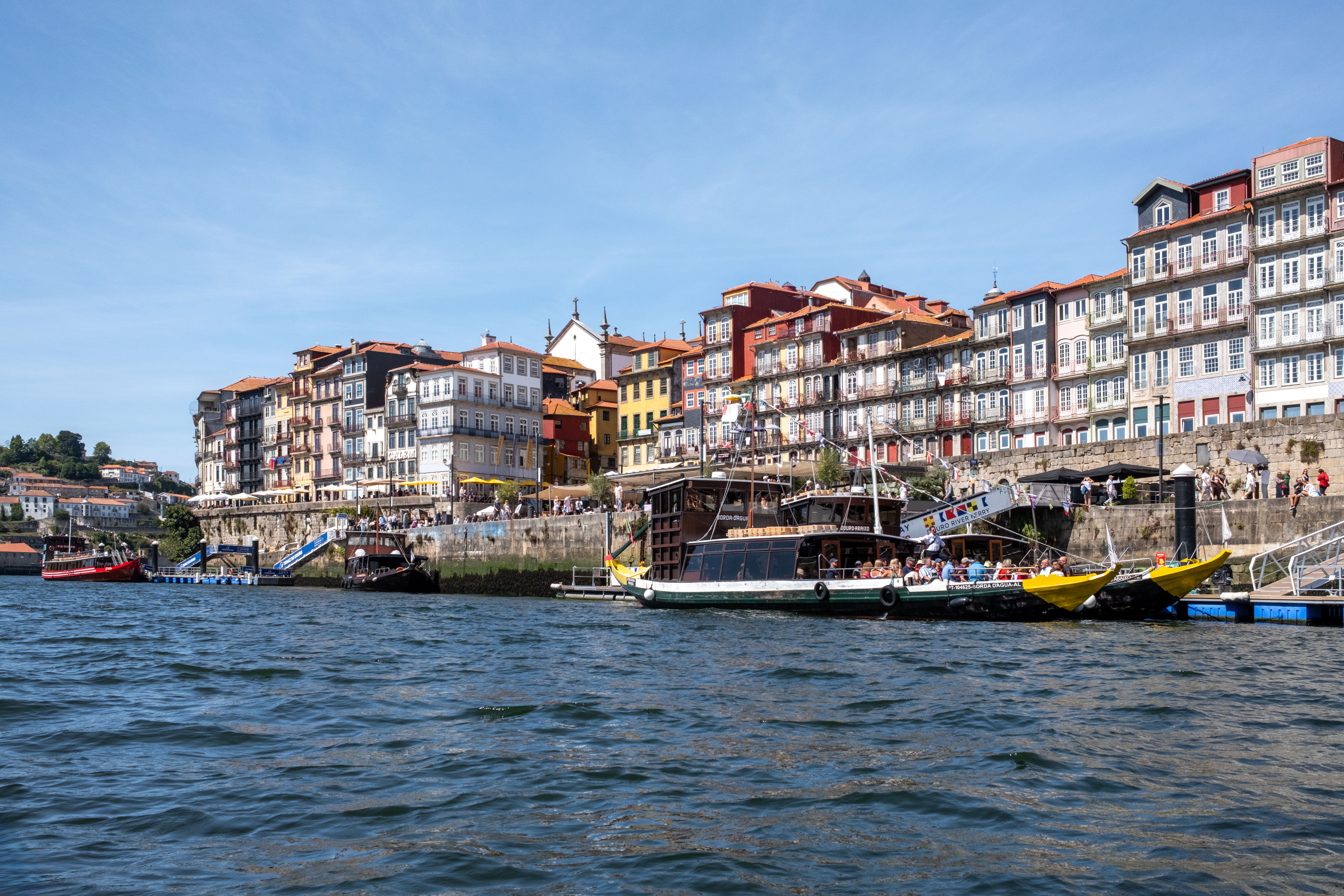 Colorful Porto Riverside with Traditional Boats · Free Stock Photo