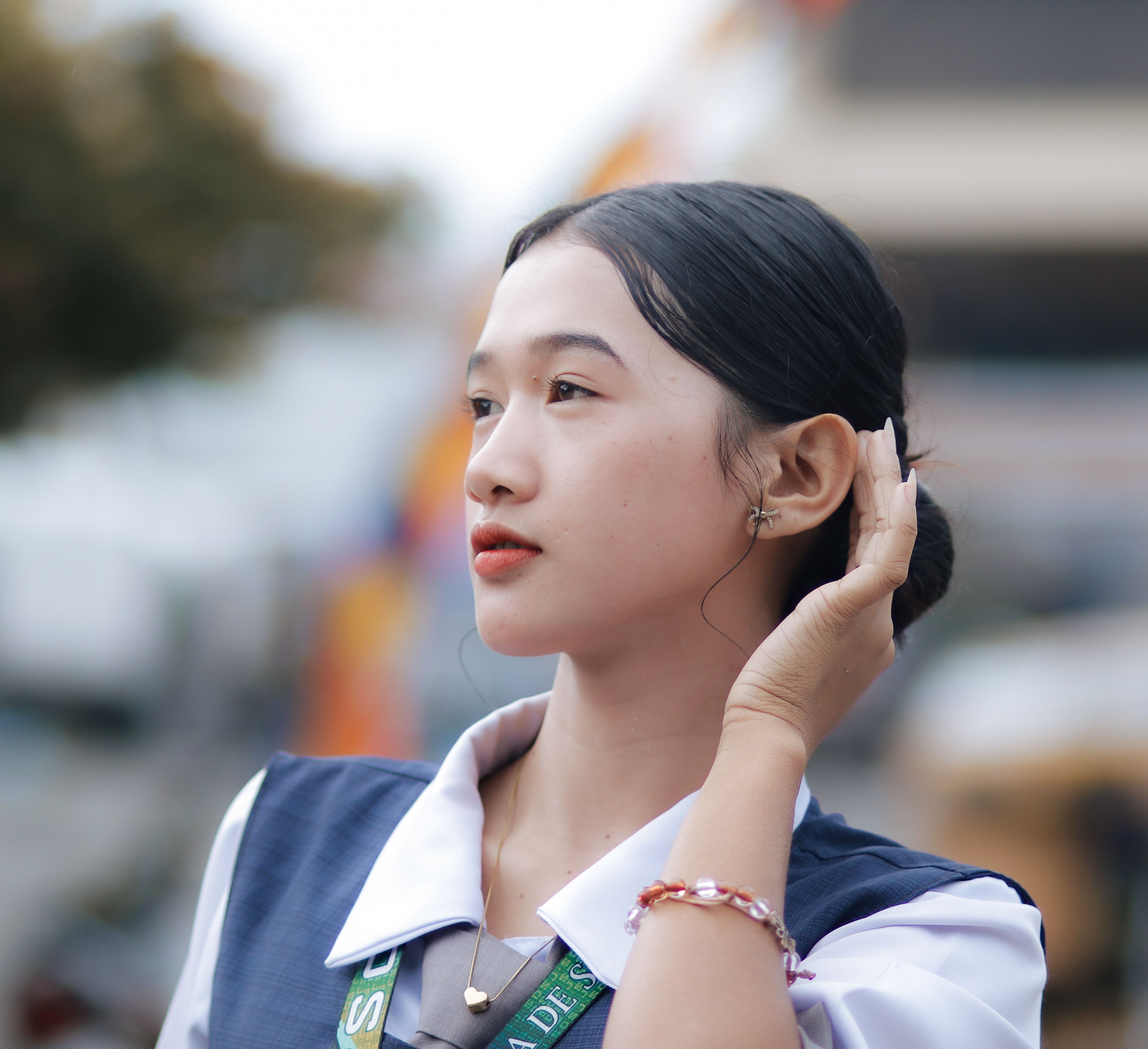 Portrait of Young Woman Outdoors in Casual Attire