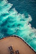 Ship deck above turquoise water, photo by Leo Willians on Pexels