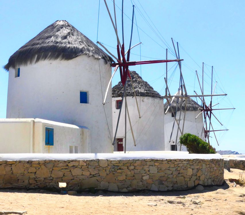 Iconic Mykonos Windmills Under Clear Skies · Free Stock Photo