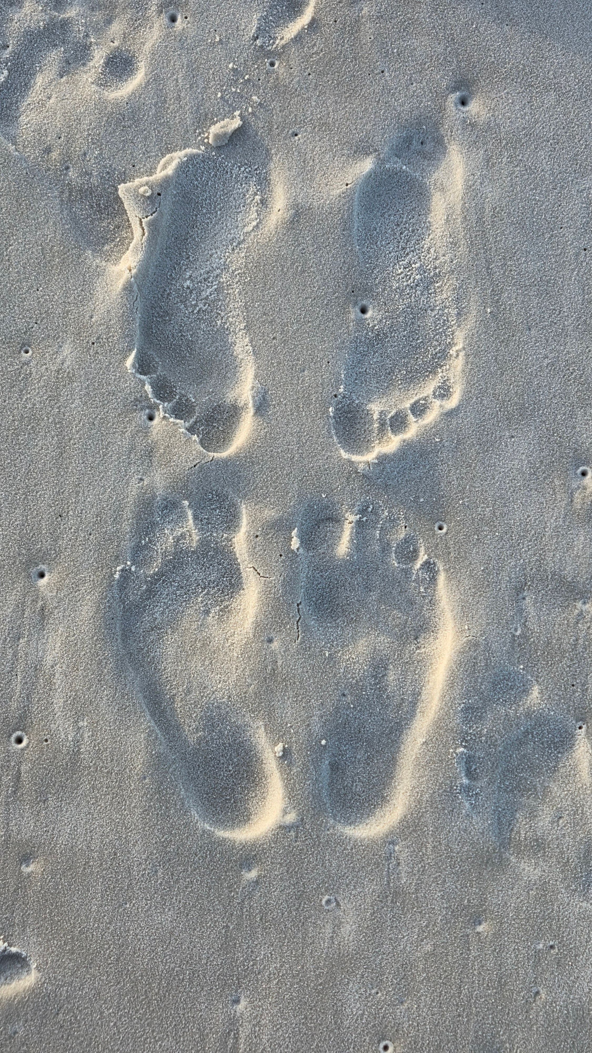 Footprints in the sand at Pensacola Beach