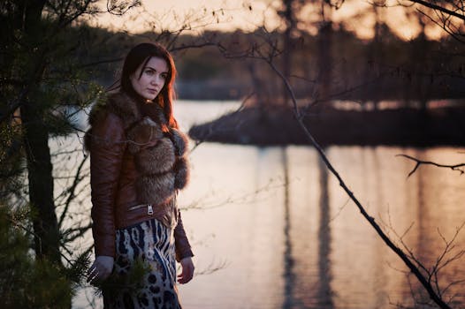 Woman in Black Leather Jacket Standing Before Green Leaved Trees · Free ...