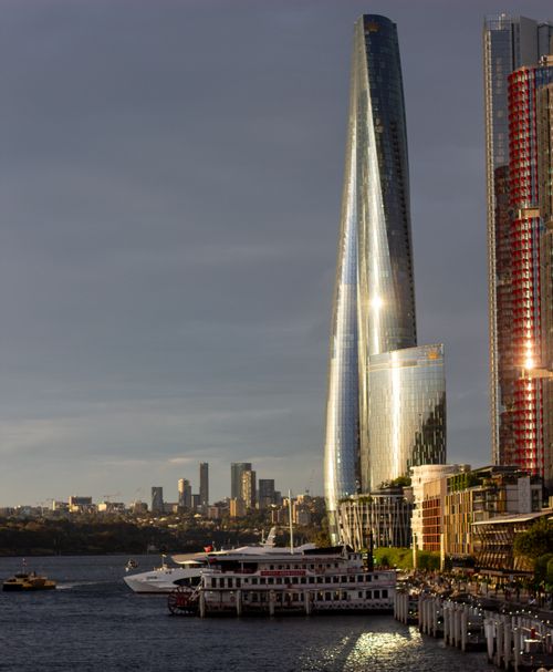Free Breathtaking view of Sydney skyscraper reflecting sunset light, captured from a harbor location. Stock Photo