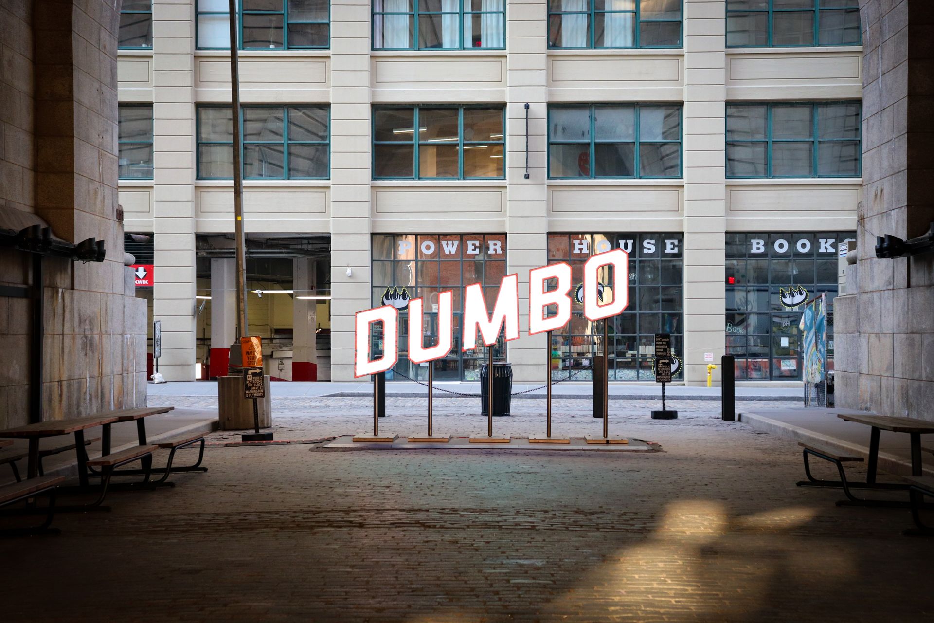 DUMBO sign in a Brooklyn underpass captures urban architecture and street life.