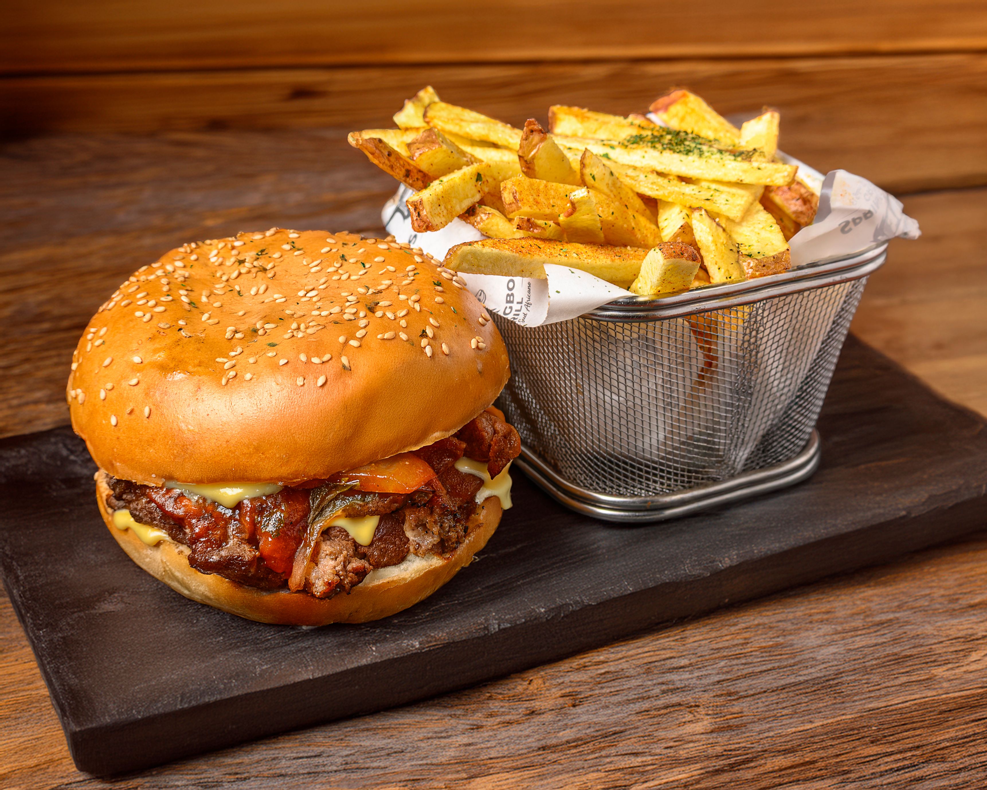 Delicious Gourmet Burger with Fries on Slate · Free Stock Photo