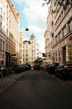 A picturesque street in Vienna showcasing elegant historic architecture and urban charm.