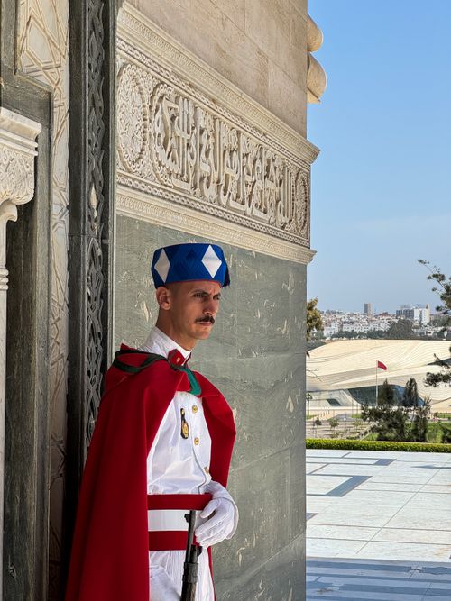 Free A royal guard in traditional attire stands at the Mausoleum of Mohammed V in Rabat, Morocco. Stock Photo