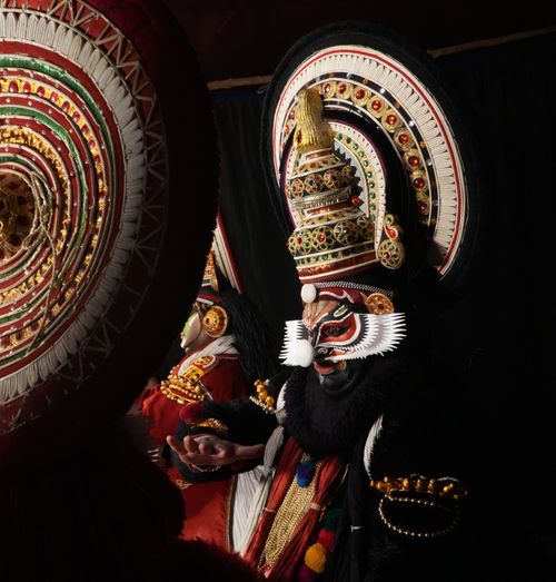 Free Vibrant and intricate Kathakali performance showcasing elaborate costumes and face makeup under dramatic lighting. Stock Photo