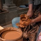 Kiln community — hands shaping pottery, photo by Ugur Tandogan on Pexels