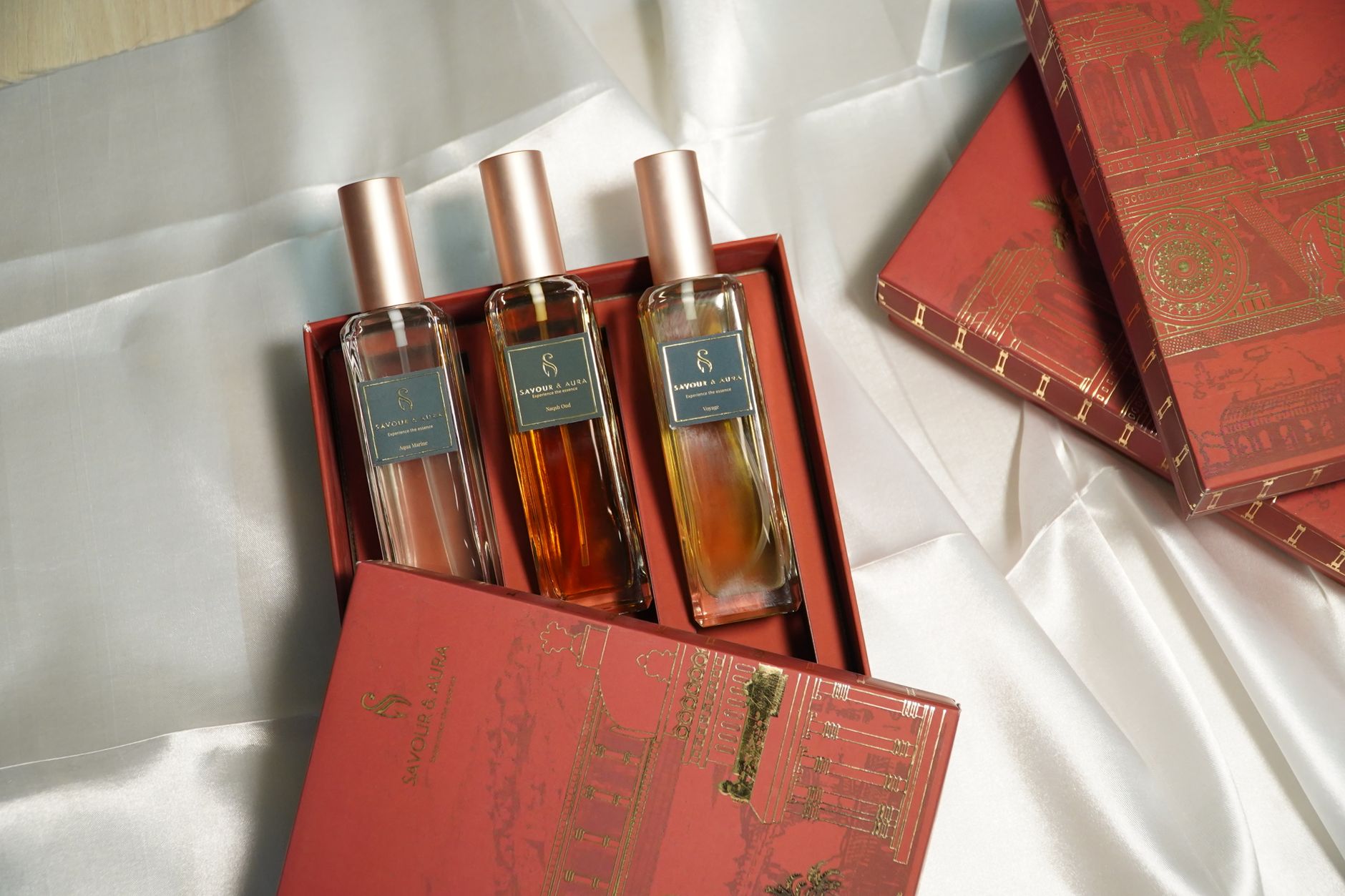 Elegant perfume gift set on silk, perfect for special occasions.