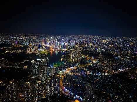 A vibrant aerial view of Hồ Chí Minh City skyline illuminating the night.