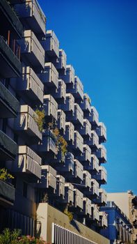 Contemporary building with balconies in Bari, Apulia showcasing urban architecture.