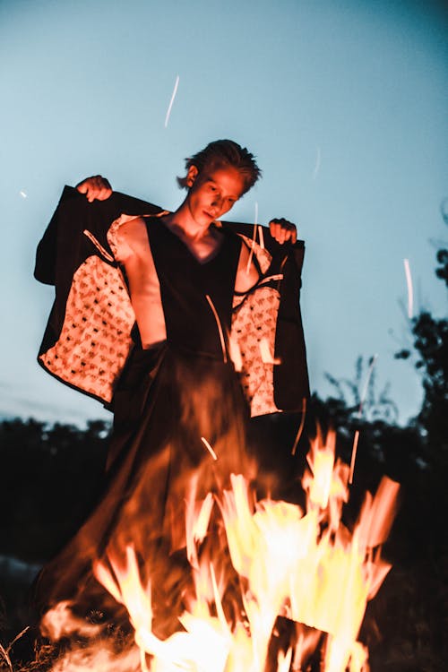Man Standing Beside Bonfire · Free Stock Photo