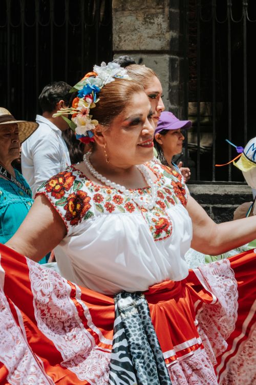 Free A woman dances in traditional attire at a vibrant festival in Oaxaca, Mexico. Stock Photo