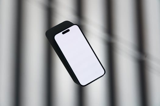 Minimalist image of a smartphone with a blank screen set against an abstract backdrop, ideal for tech-focused content.